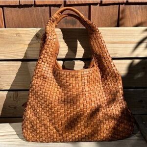 Distressed basket weave woven leather
Hobo, Travel carryall bag